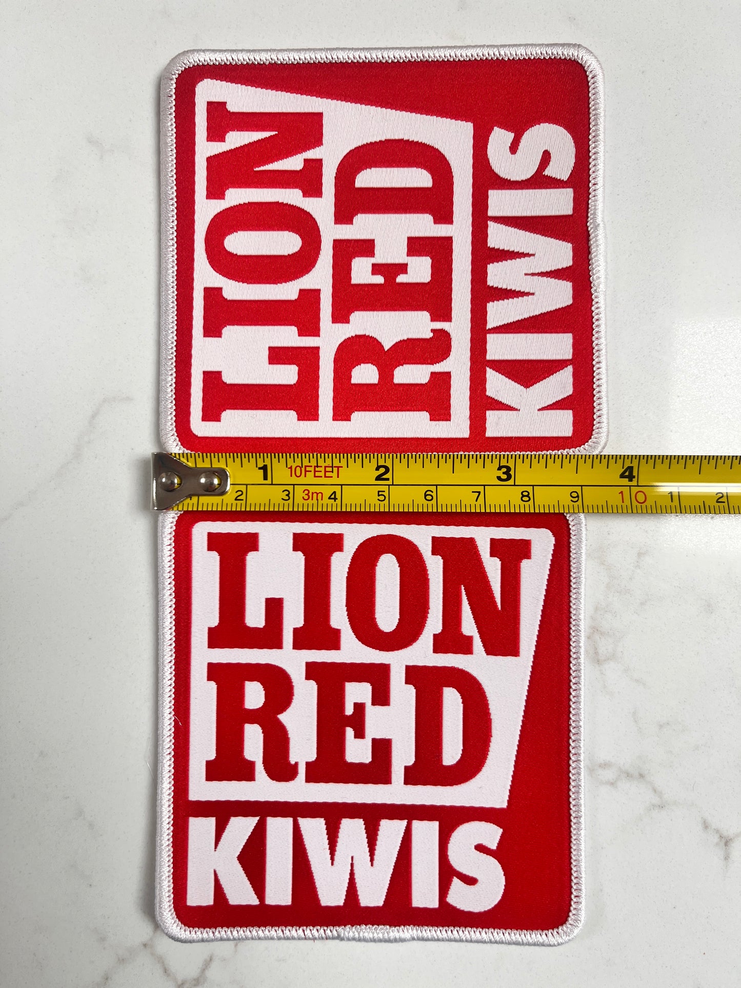 Lion Red x2 sleeve badges (squares)